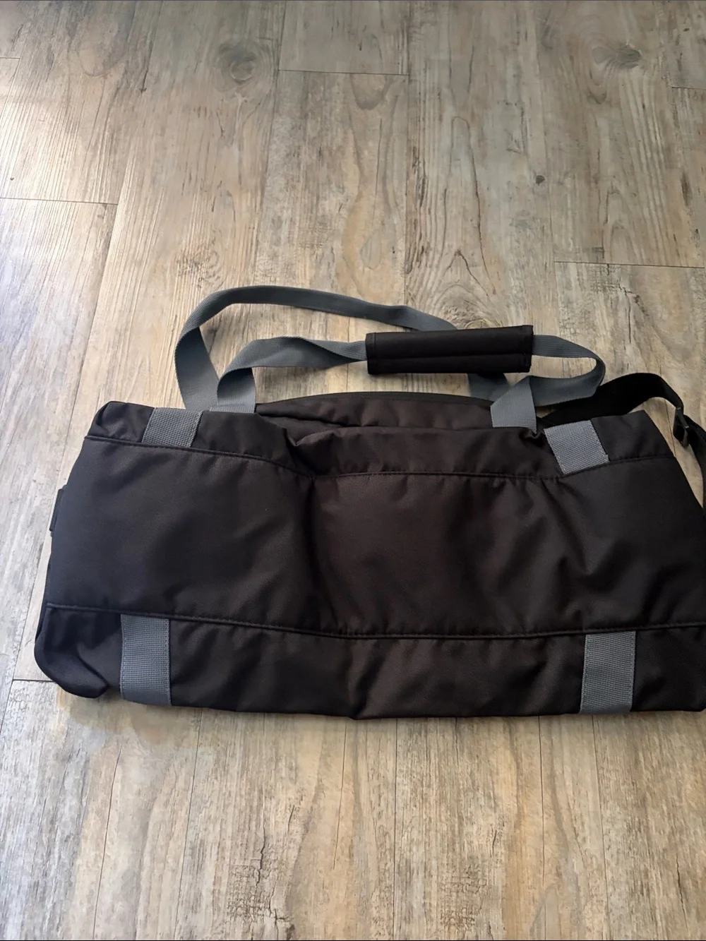 Nike Black Duffel Bag with Gray Straps and White Logo
